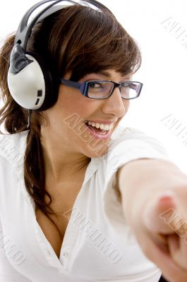 front view of smiling businesswoman pointing