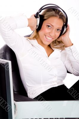 smiling businesswoman listening music