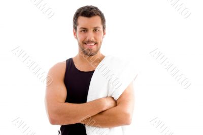 smiling young man with folded arms