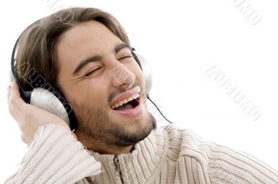 handsome male listening to music with headphones