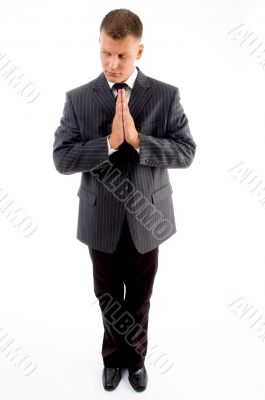praying executive looking sideways