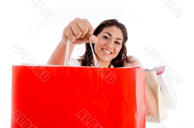 portrait of woman showing shopping bags