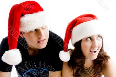 portrait of young couple wearing christmas hat