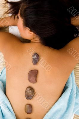 pretty woman getting hot stone massage