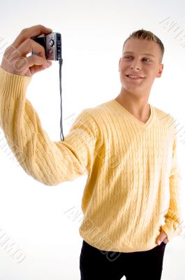 standing male with camera