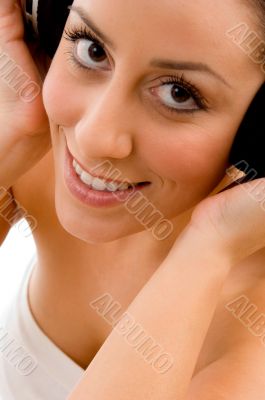top view of smiling woman enjoying music
