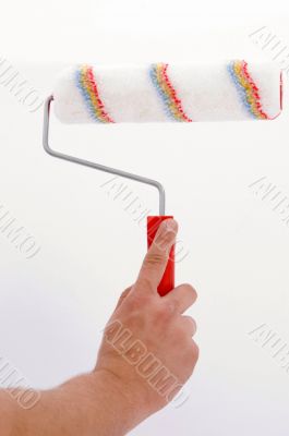 hand holding painting roller
