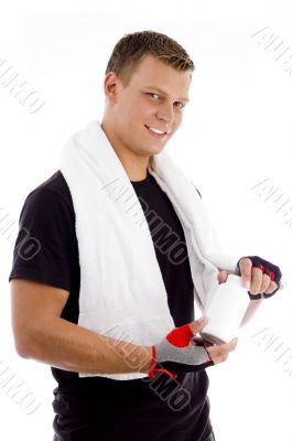muscular male holding medicine bottle