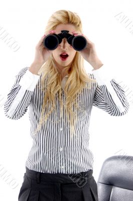 front view of woman looking through binocular