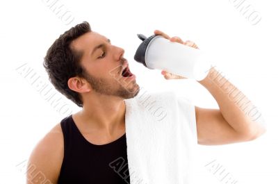 man drinking while exercising