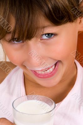 smiling girl with a glass of milk