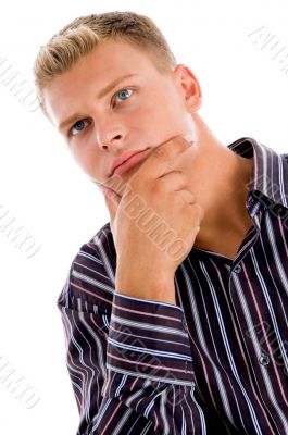 young man sitting and facing the camera