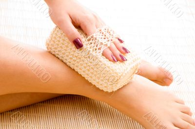close view of woman scrubbing her in spa