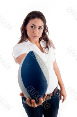 young woman showing rugby ball