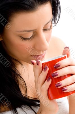 woman holding coffee mug against white background