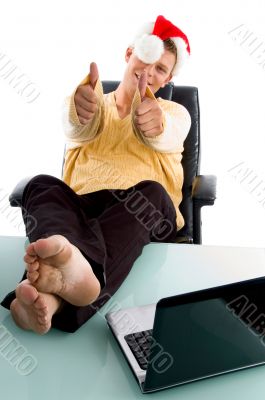christmas hat wearing male showing both thumb up