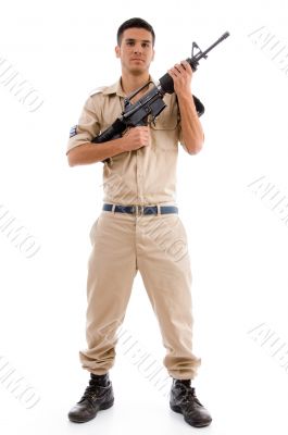 standing soldier posing with gun