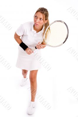 player with tennis racket looking aside