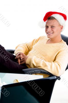 smiling male wearing christmas hat