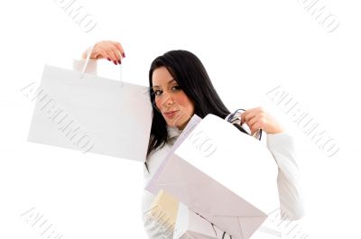 woman showing shopping bags on white background