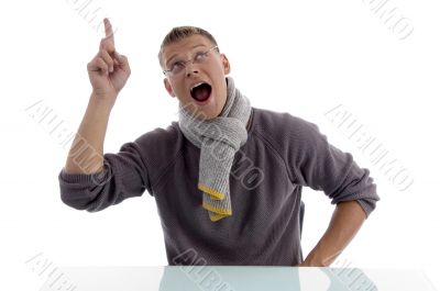 man looking and pointing upward