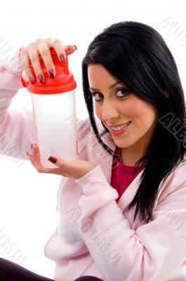 smiling female holding water bottle on white backg