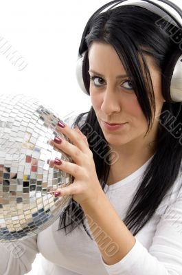 serious woman with disco ball and headphone