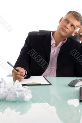 thinking businessman looking upward