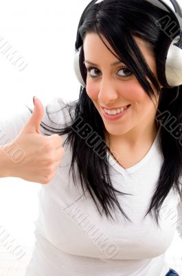 woman showing thumb up on white background