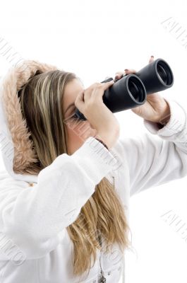 professional photographer eyeing with binoculars