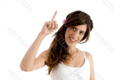 smiling female showing index finger