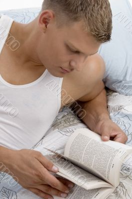 handsome male reading book
