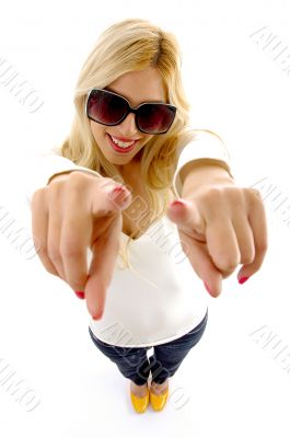 smiling female model with pointing fingers