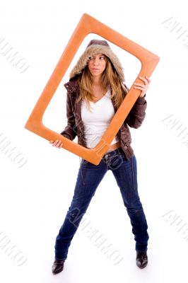front view of sexy woman holding frame