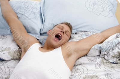 yawning man stretching his arms