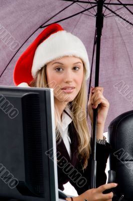 professional woman wearing christmas hat
