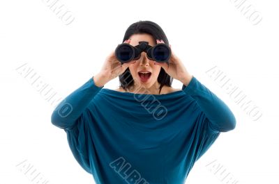 female looking through binocular