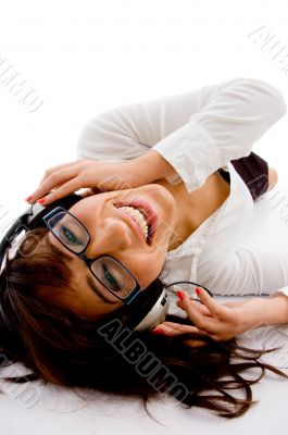 top view of smiling female enjoying music