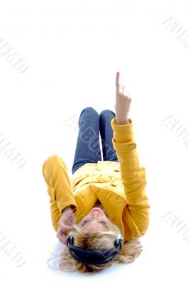 high angle view of pointing woman with headphone