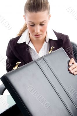 woman looking into suitcase