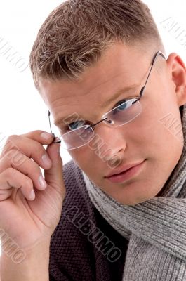 young man holding eyewear