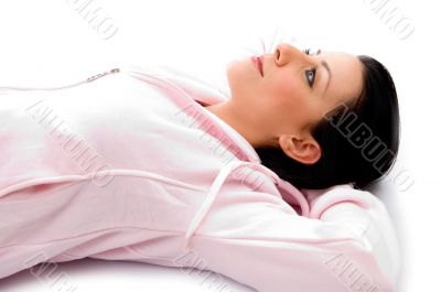 side view of laying woman looking upward