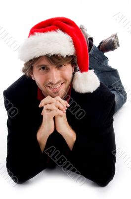 smiling laying male wearing christmas hat