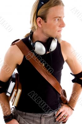 male with bag and books