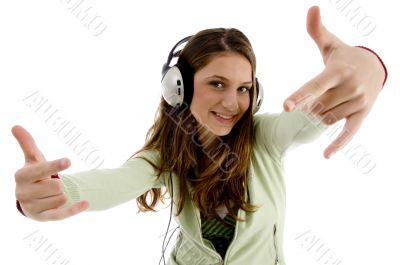 female listening to music and showing hand gesture