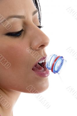 side view of female drinking water