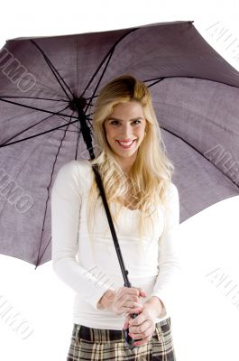 front view of happy woman with umbrella