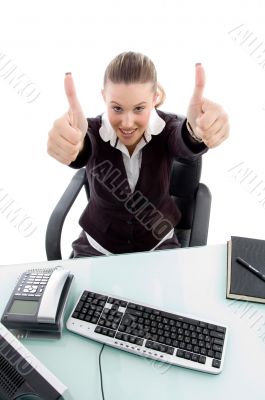 young sitting woman with thumbs up