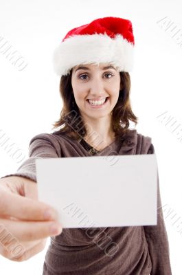 woman wearing christmas hat holding business card