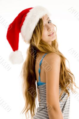 cute teenager girl wearing christmas hat